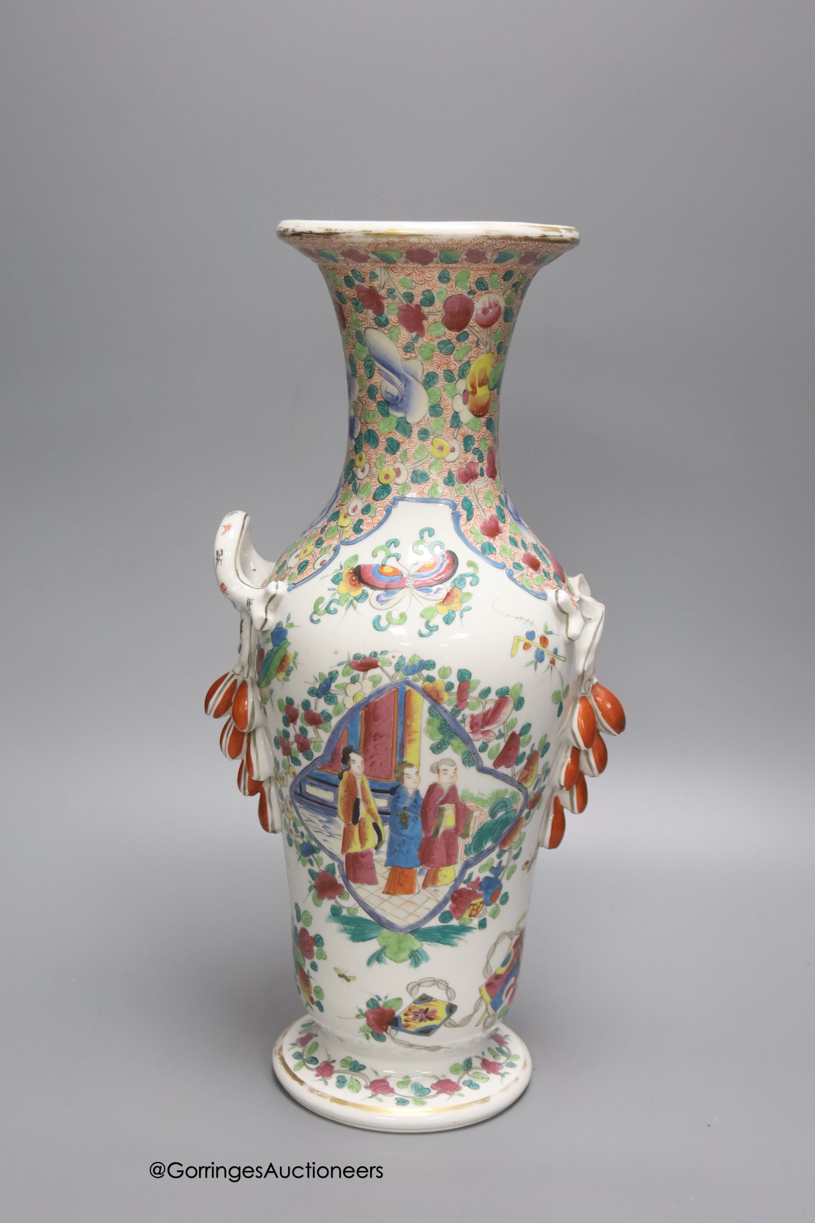 A 19th century French porcelain vase, enamelled in Chinese famille rose style, 38cm